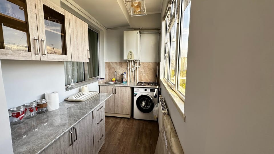 Kitchen or kitchenette, washing machine
