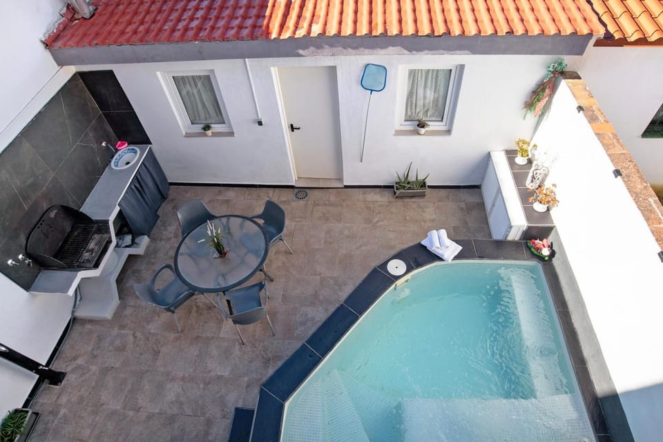 Property building, Living room, Swimming pool