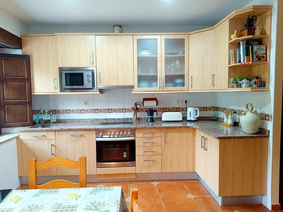 Kitchen or kitchenette, dishwasher, oven, stove, toaster