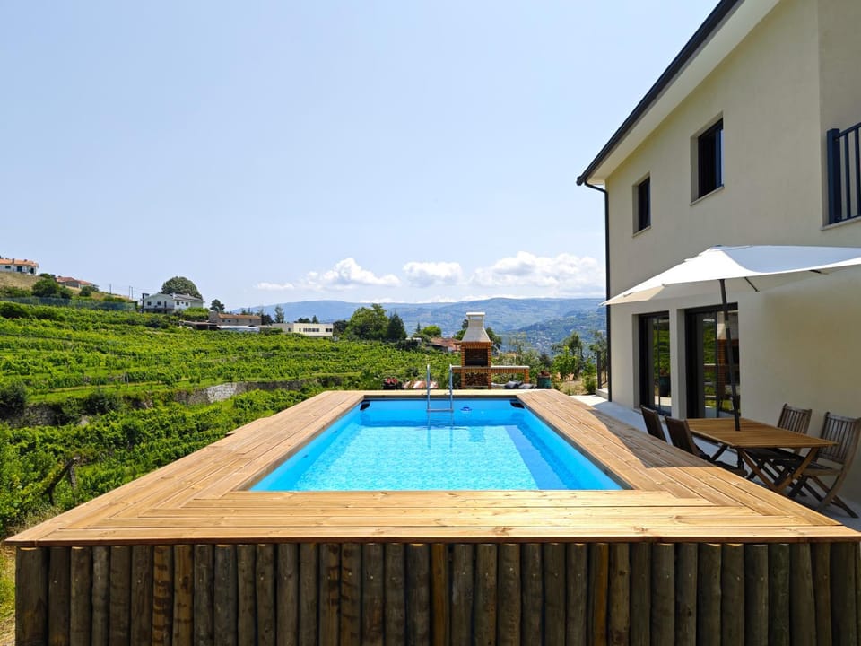 Property building, Patio, Day, Natural landscape, Mountain view, Pool view, Swimming pool