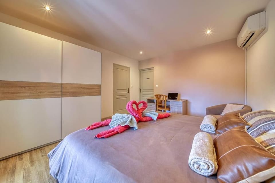 Bed, Seating area, Bedroom, towels, wardrobe, air conditioner