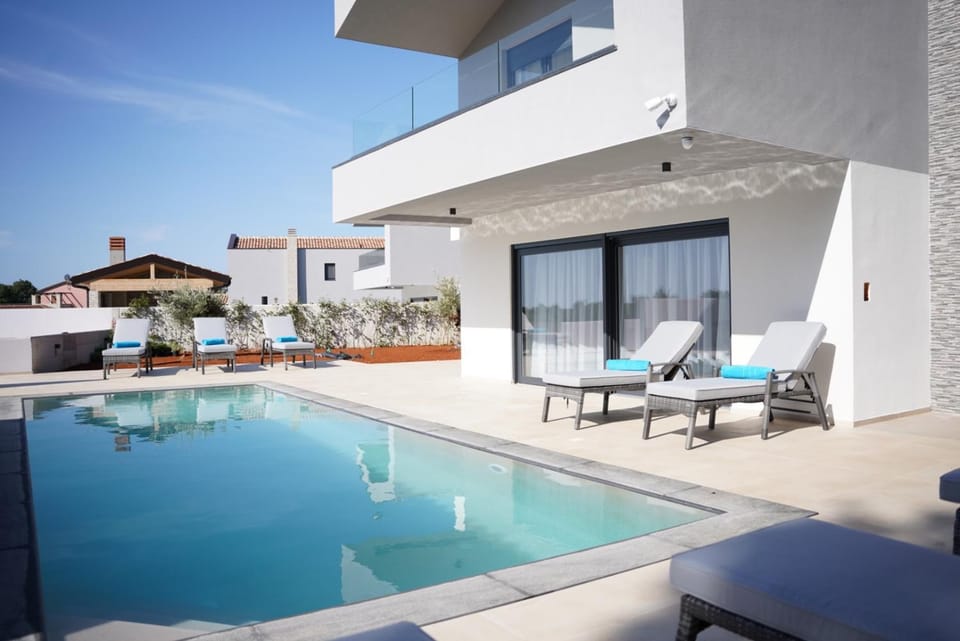 Property building, Patio, Day, View (from property/room), Pool view, Swimming pool, sunbed