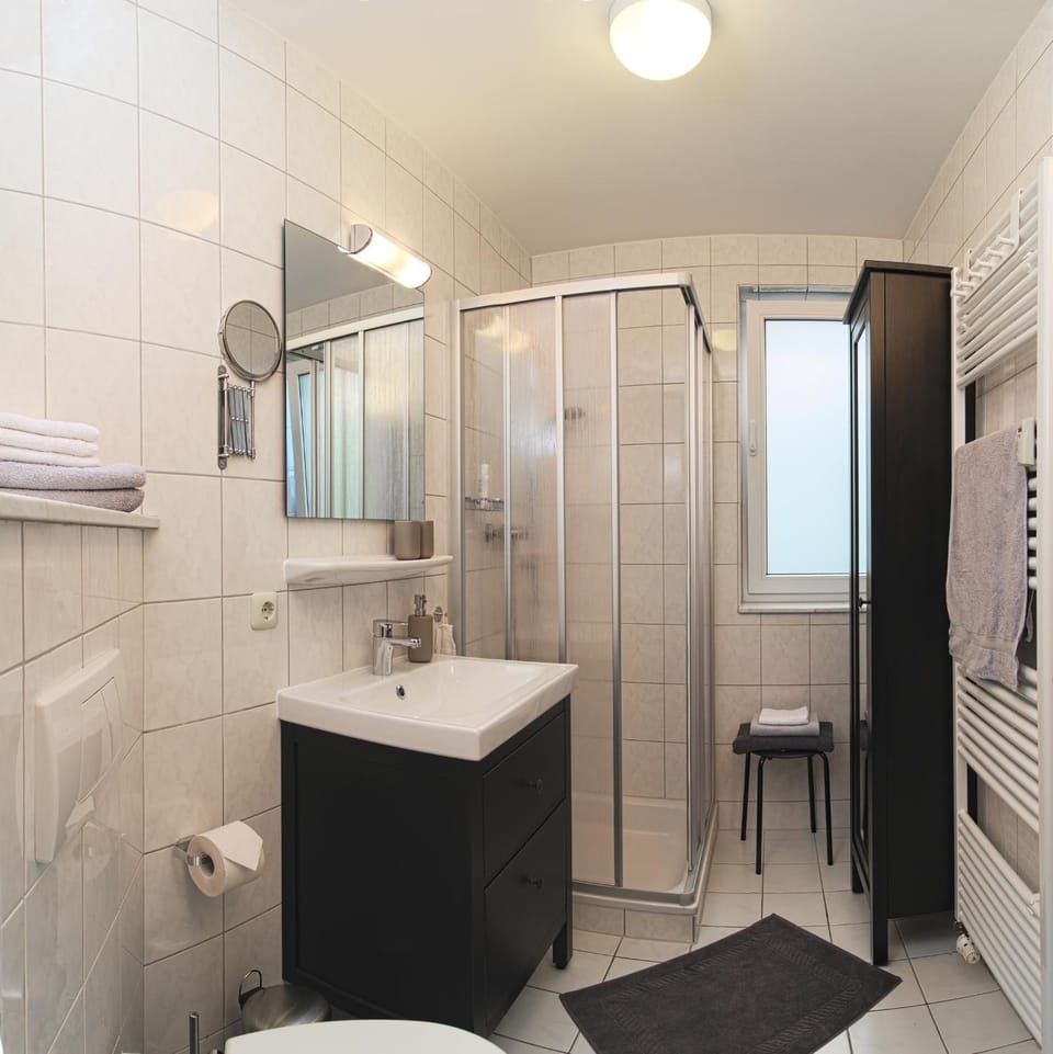 Shower, Toilet, Bathroom, hair dryier, towels