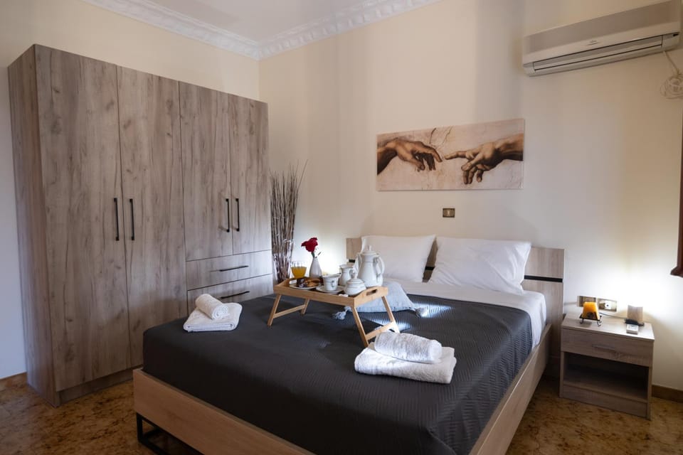 Bed, Photo of the whole room, Bedroom, towels, air conditioner