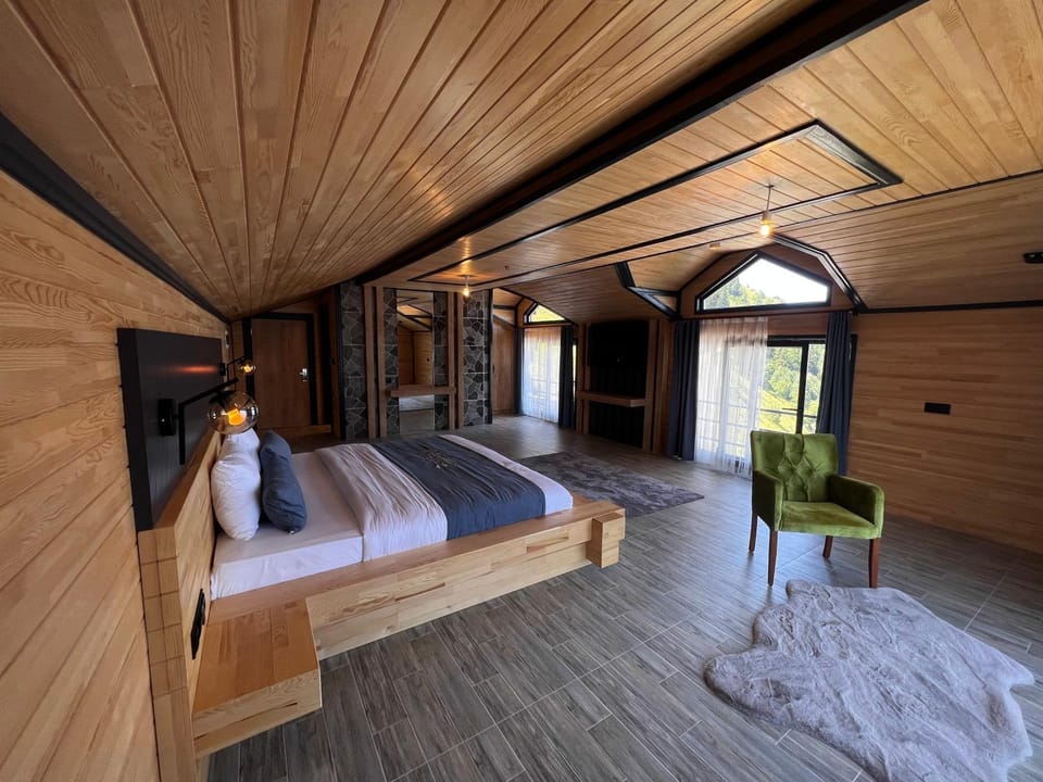 Bed, Living room, Seating area, Bedroom