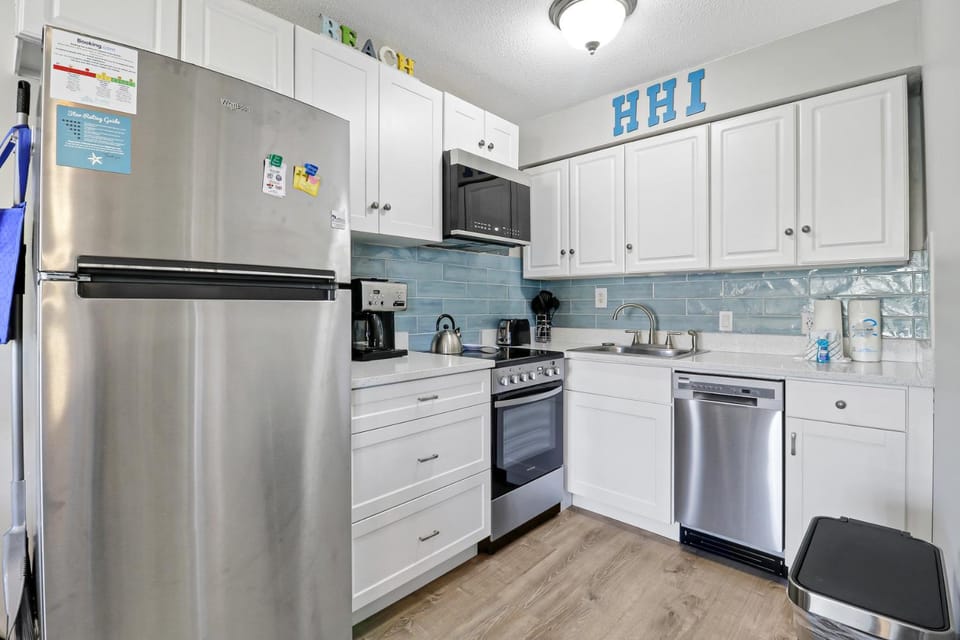 Kitchen or kitchenette, dishwasher, oven, stove, toaster, dryer