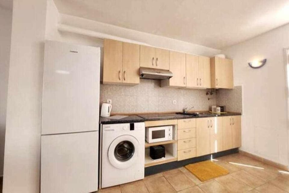 Kitchen or kitchenette, washing machine