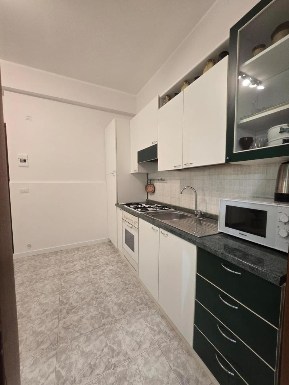 Kitchen or kitchenette, oven, stove