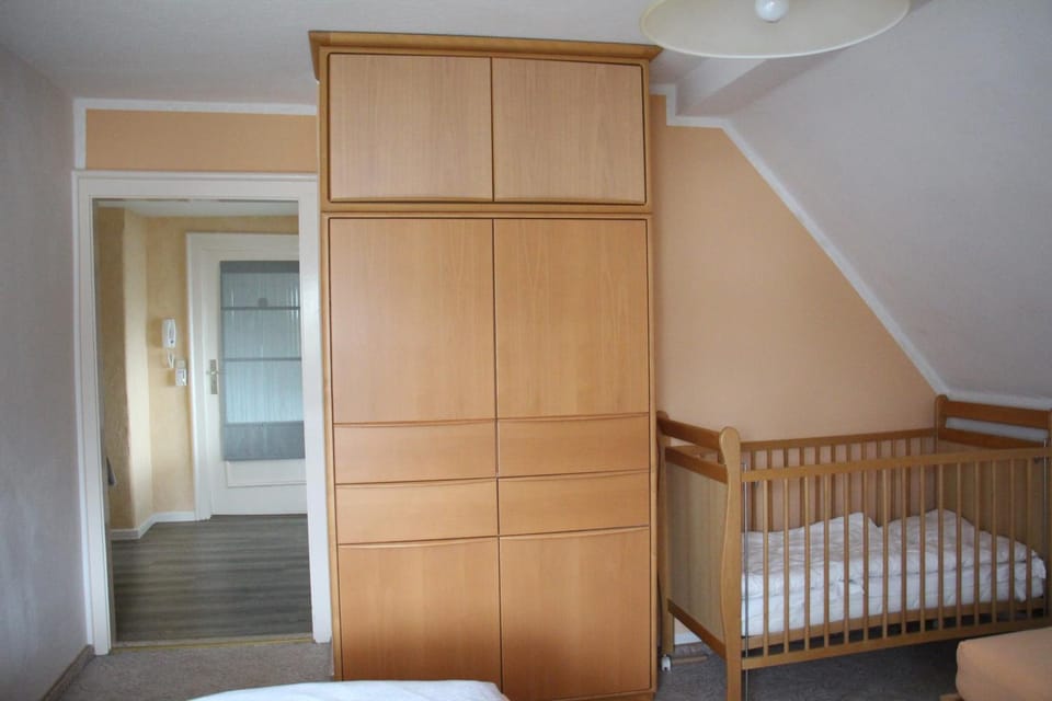 cot, wardrobe