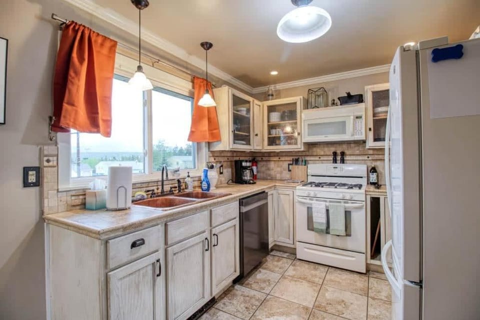 Kitchen or kitchenette, dishwasher, microwave, oven, stove