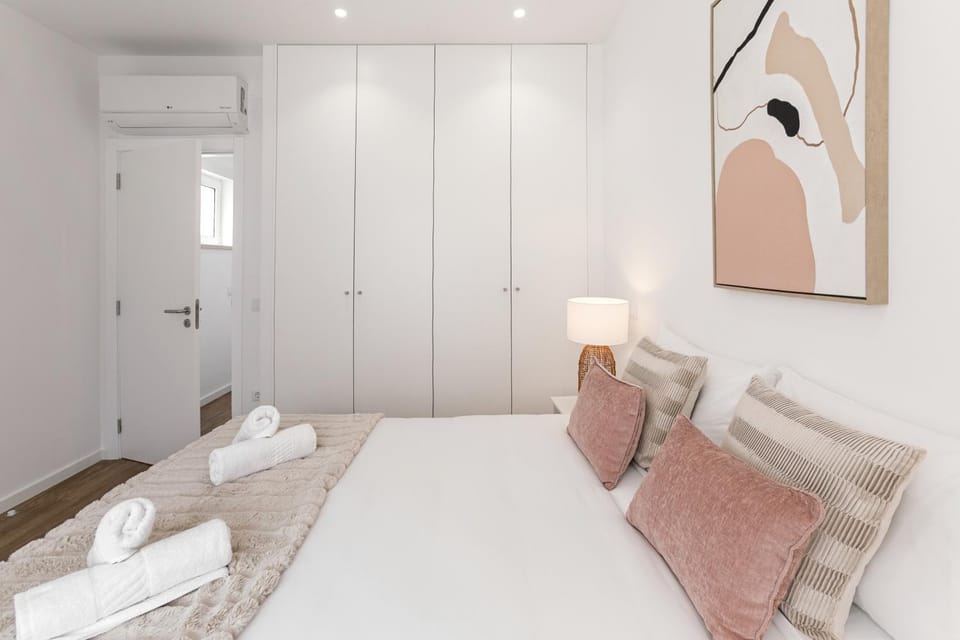 Bed, Decorative detail, Bedroom, towels, wardrobe, air conditioner