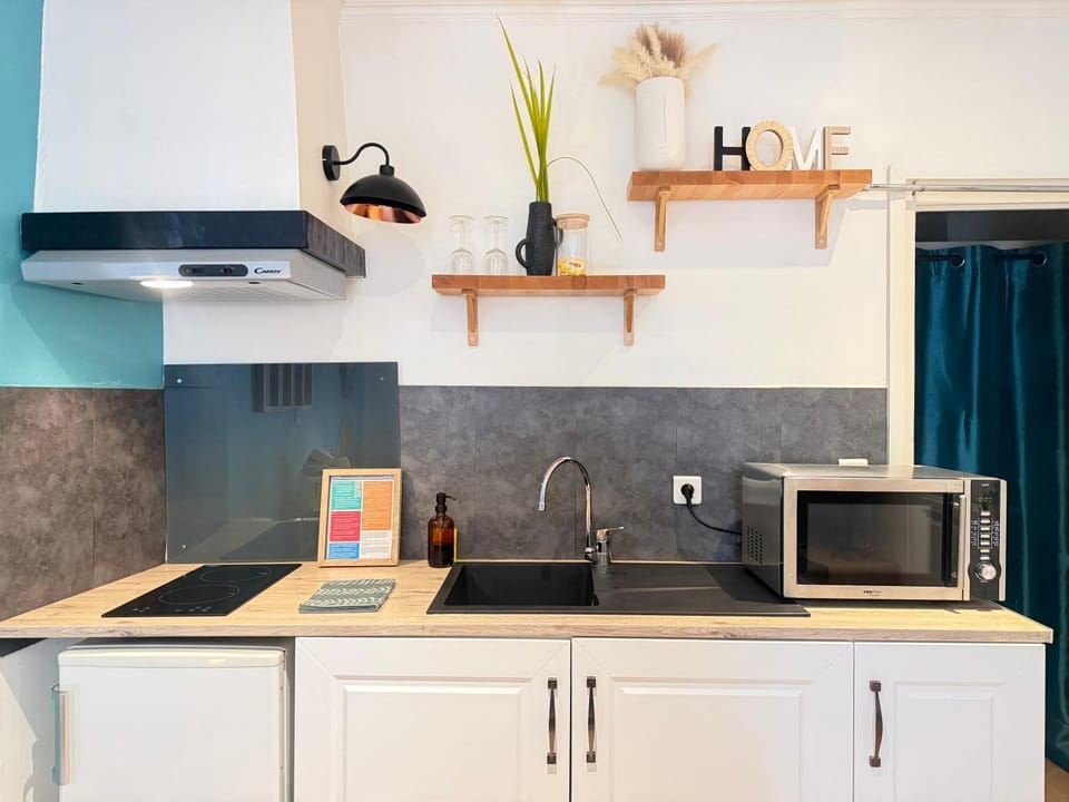 Kitchen or kitchenette, microwave, stove, toaster