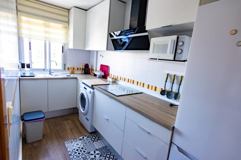 Kitchen or kitchenette, stove, washing machine