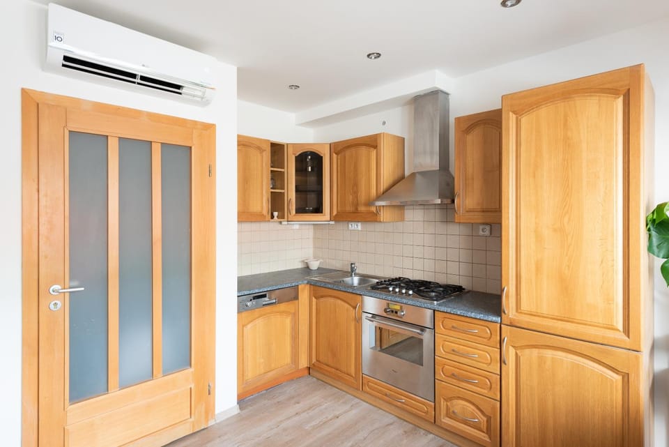 Kitchen or kitchenette, oven, stove, air conditioner