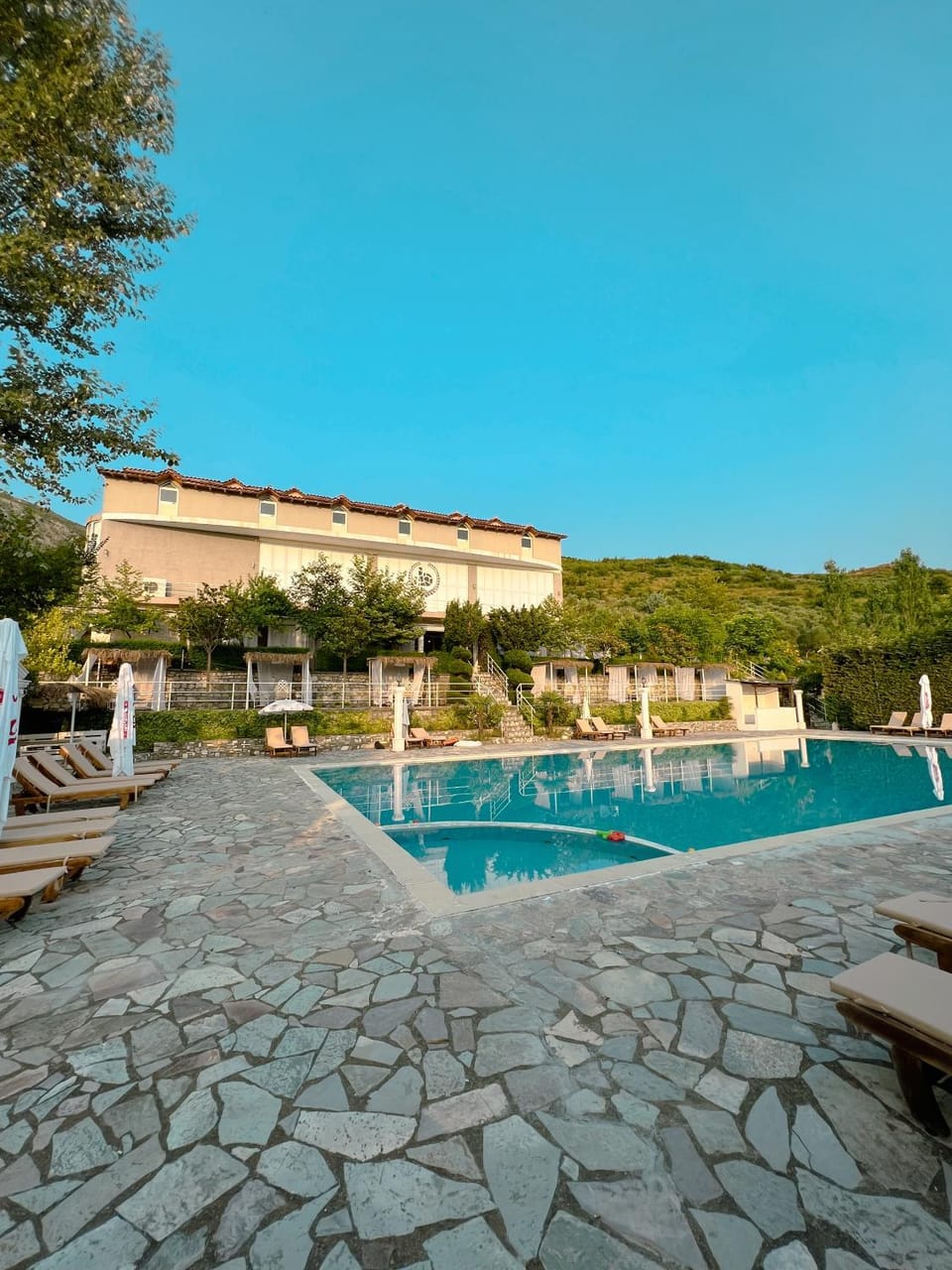Property building, Day, Natural landscape, Pool view, Swimming pool, sunbed