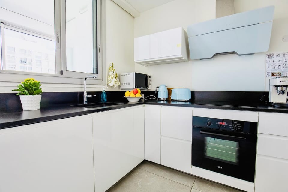 Kitchen or kitchenette, dishwasher, oven, stove