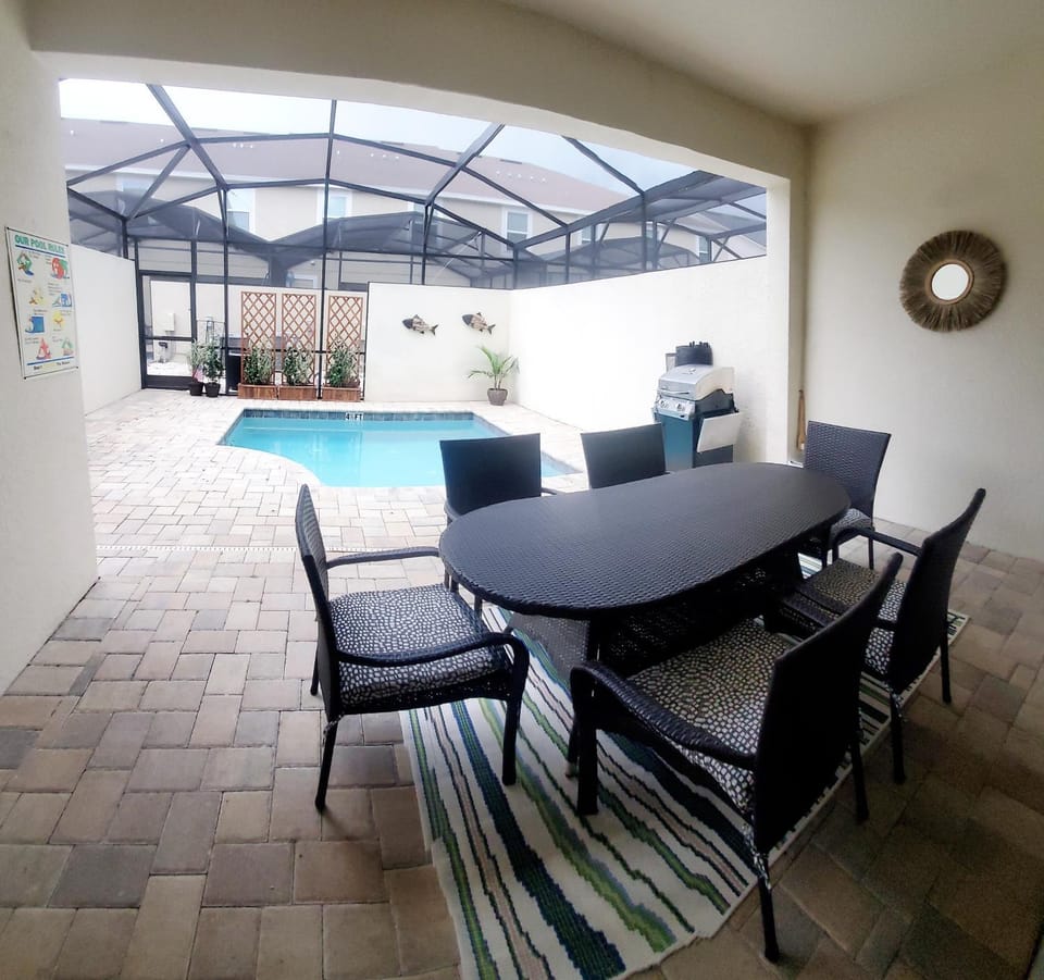 Patio, Seating area, Dining area, Pool view, Swimming pool