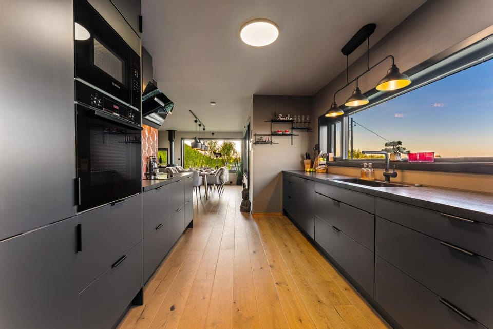 Kitchen or kitchenette, dishwasher, oven, stove
