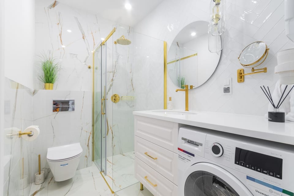 Shower, Toilet, Bathroom, towels, washing machine, dryer