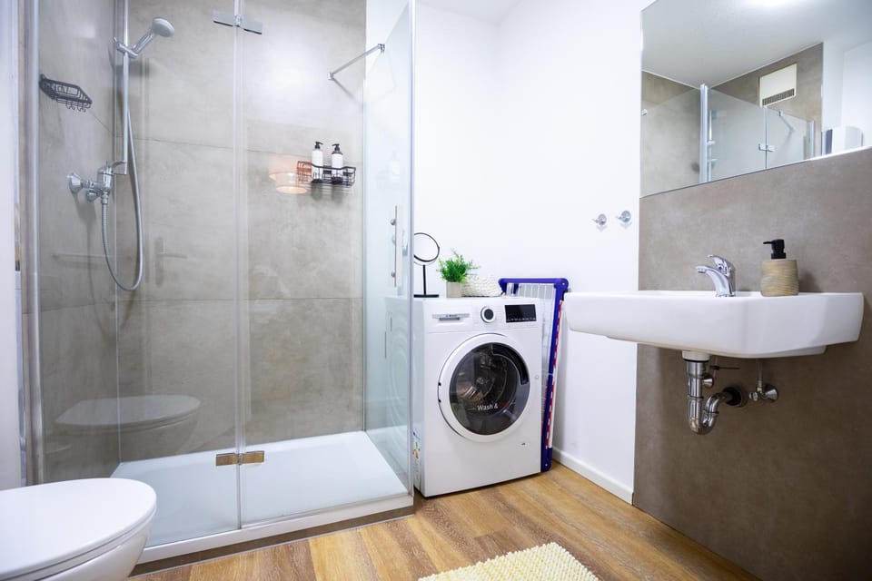Shower, Toilet, Bathroom, towels, washing machine, dryer