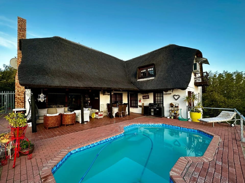 Property building, Patio, Pool view, Swimming pool, sunbed