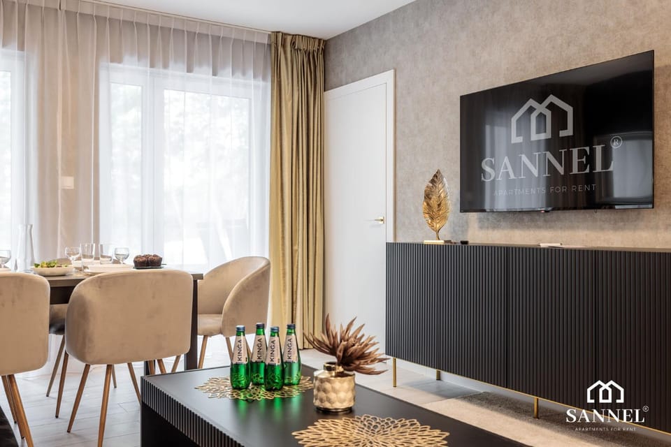 Property logo or sign, TV and multimedia, Living room, Decorative detail, Decorative detail, Seating area, Dining area