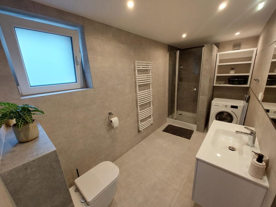 Shower, Toilet, Bathroom, towels, washing machine, dryer