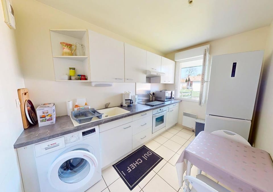 Kitchen or kitchenette, oven, stove, toaster, washing machine