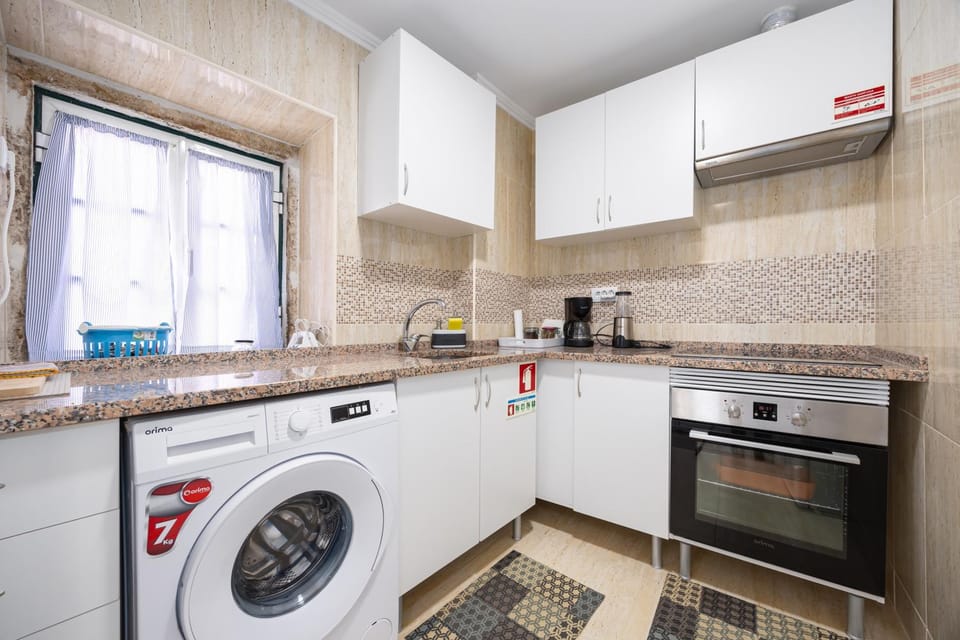 Kitchen or kitchenette, oven, stove, washing machine