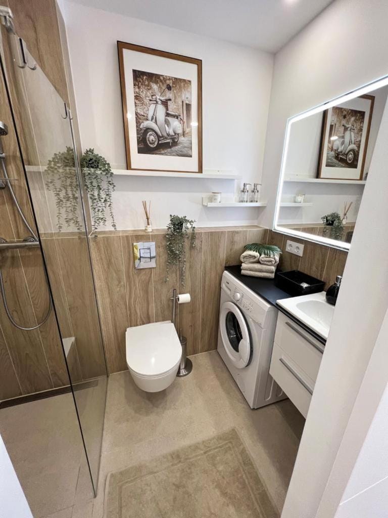 Shower, Toilet, Bathroom, towels, washing machine, dryer