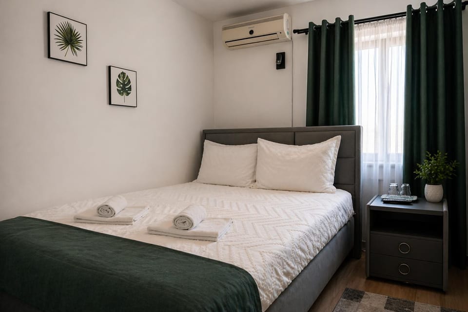 Bed, Photo of the whole room, Bedroom, towels, air conditioner