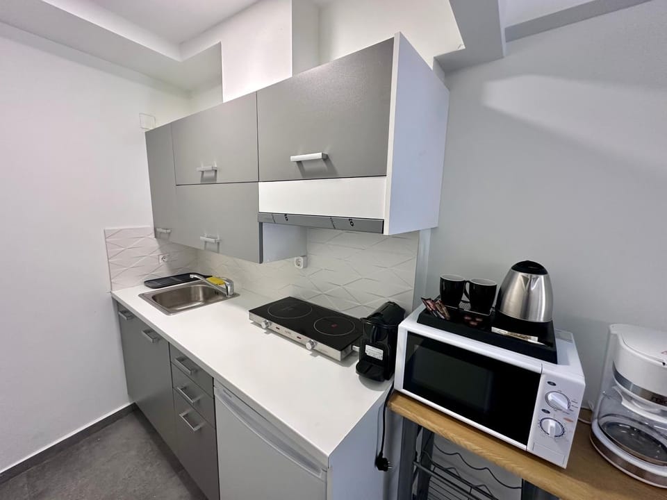 Kitchen or kitchenette, stove