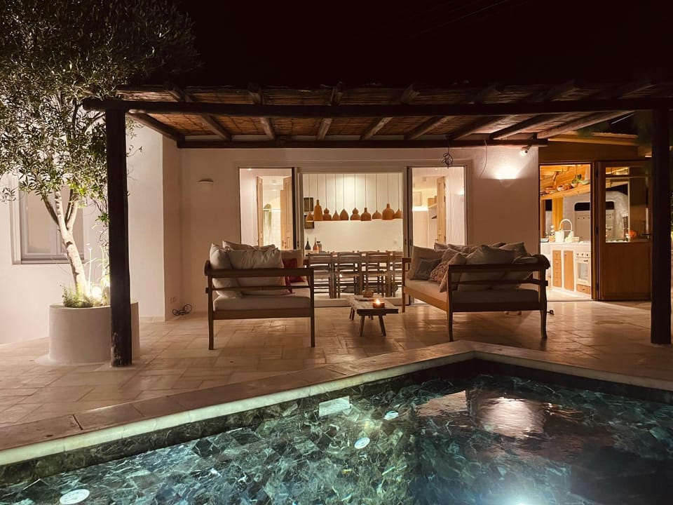 Patio, Night, Seating area, Pool view, Swimming pool