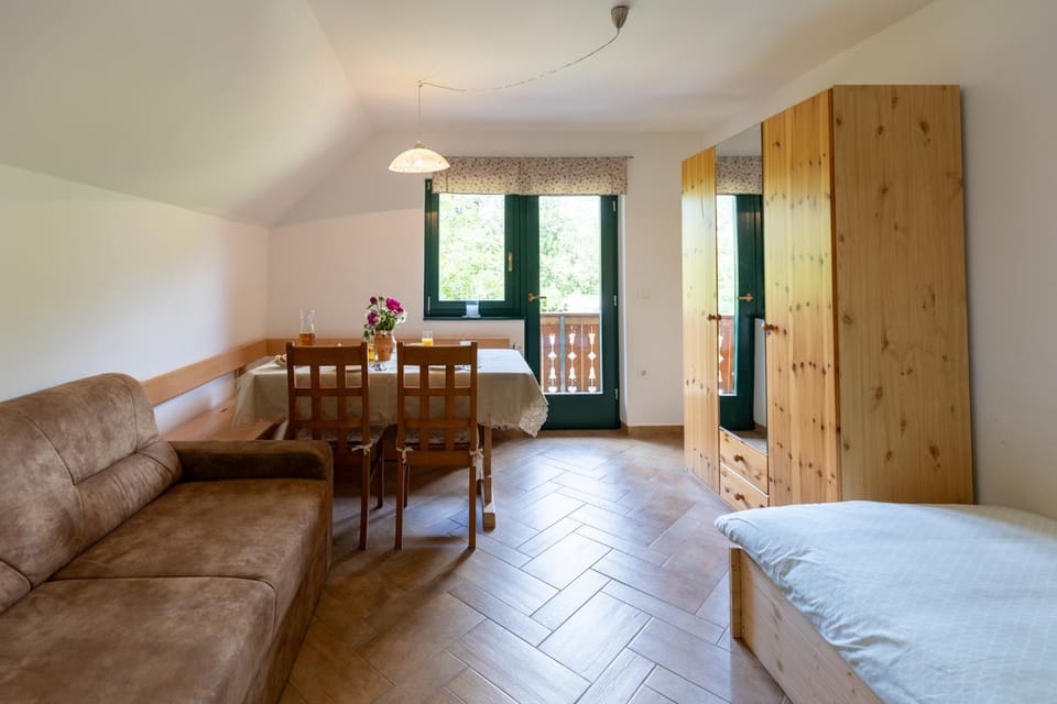 Bed, Living room, Seating area, Dining area