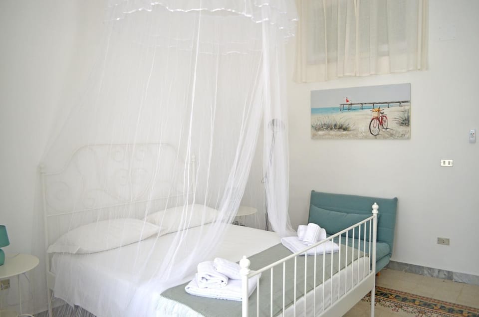 Bed, Photo of the whole room, Bedroom, hair dresser, microwave, towels, wardrobe, air conditioner