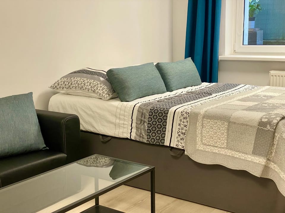 Bed, Living room, Seating area, Bedroom