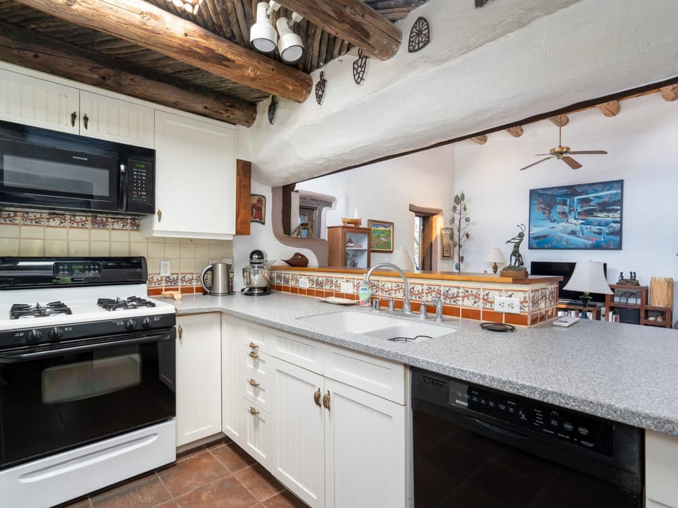 TV and multimedia, Kitchen or kitchenette, Seating area, dishwasher, furniture, microwave, stove