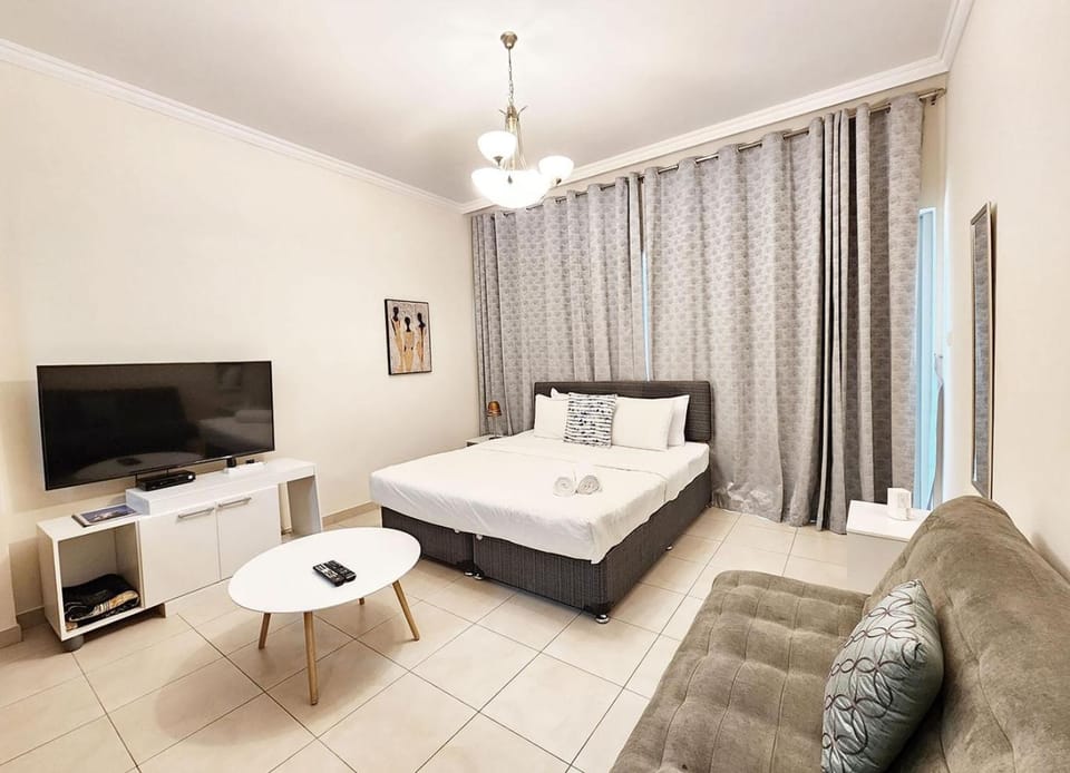 Bed, TV and multimedia, Living room, Seating area