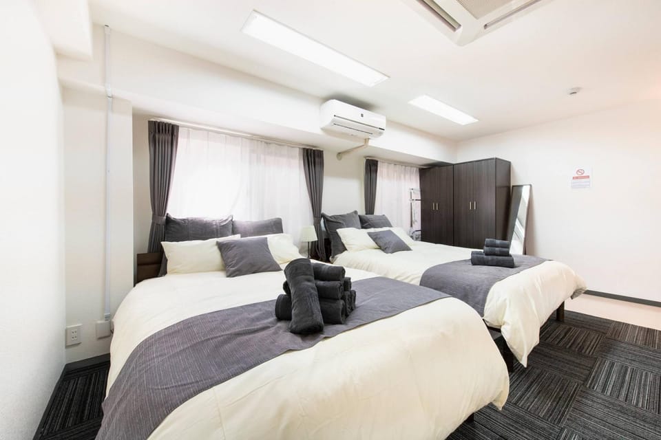 Bed, Bedroom, towels, wardrobe, air conditioner