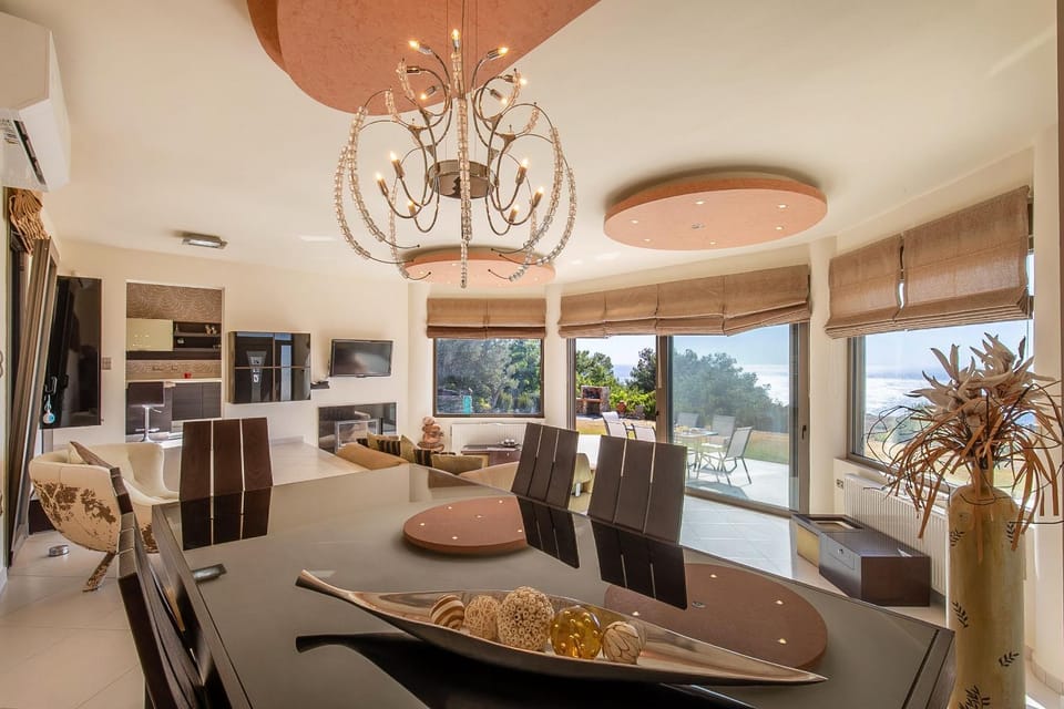 Living room, Decorative detail, Seating area, Dining area, Garden view, Sea view