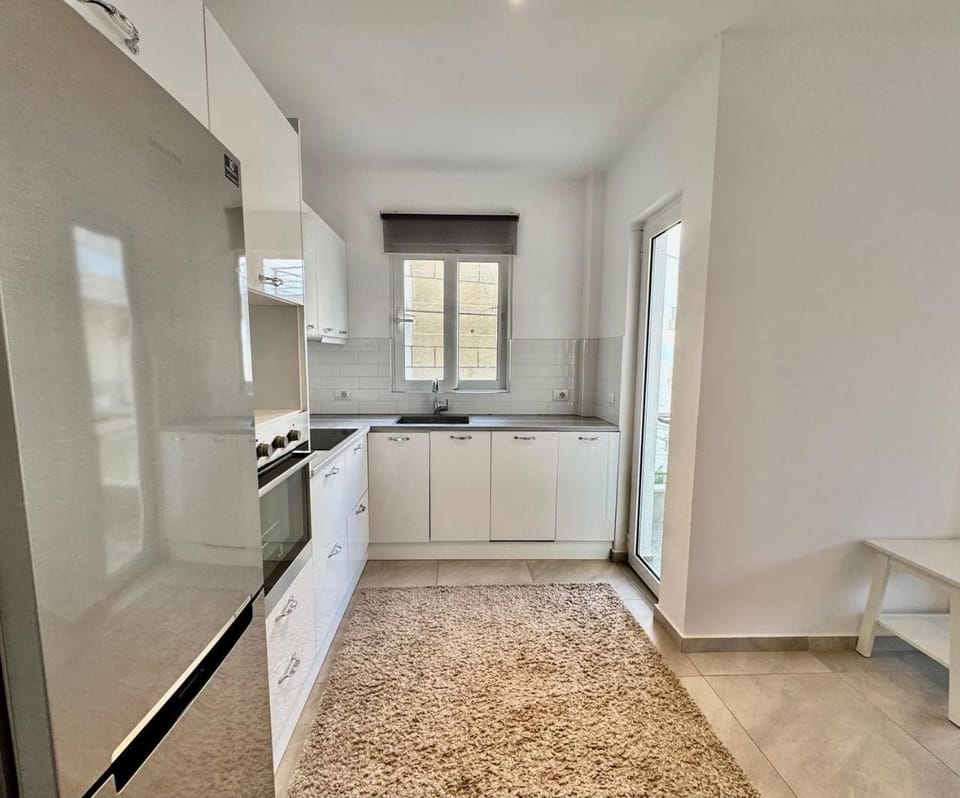 Kitchen or kitchenette, dishwasher, oven, stove