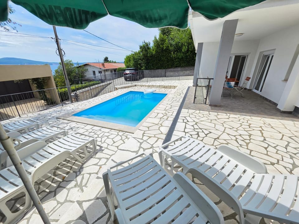 Property building, Patio, Pool view, Swimming pool, sunbed