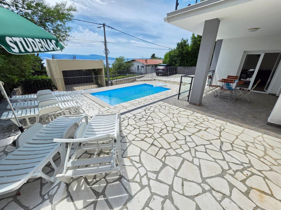 Property building, Patio, Pool view, Swimming pool, sunbed