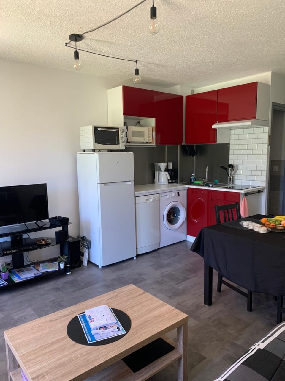 Kitchen or kitchenette, dishwasher, oven, stove, toaster, washing machine