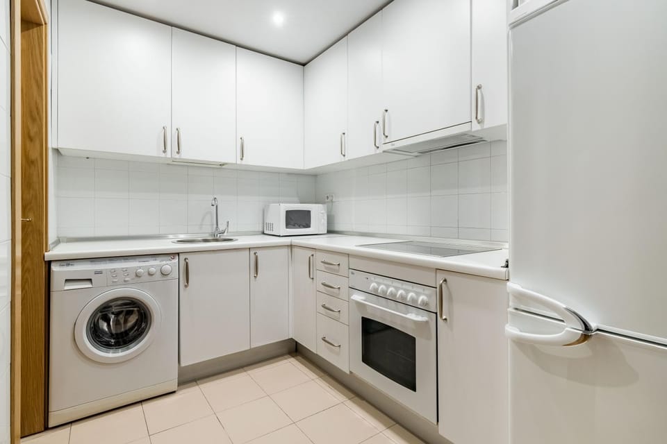 Kitchen or kitchenette, oven, stove, washing machine