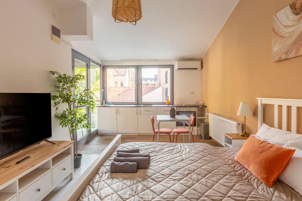 Bed, TV and multimedia, Living room, Seating area, Bedroom, hair dresser, air conditioner