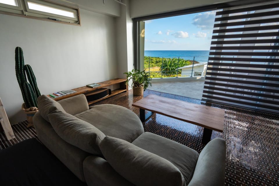 Natural landscape, View (from property/room), Living room, Seating area, Sea view