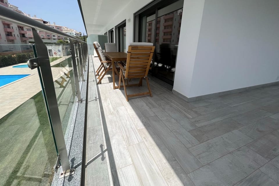 Property building, Day, View (from property/room), Balcony/Terrace, Living room, Seating area, Pool view, Swimming pool, sunbed