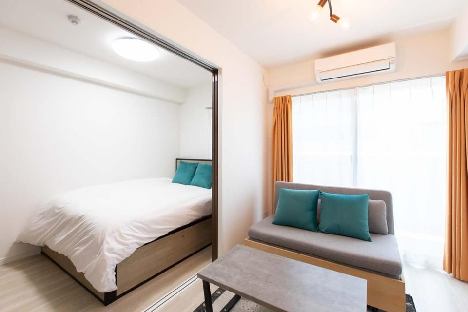 Bed, Living room, Seating area, Bedroom, air conditioner