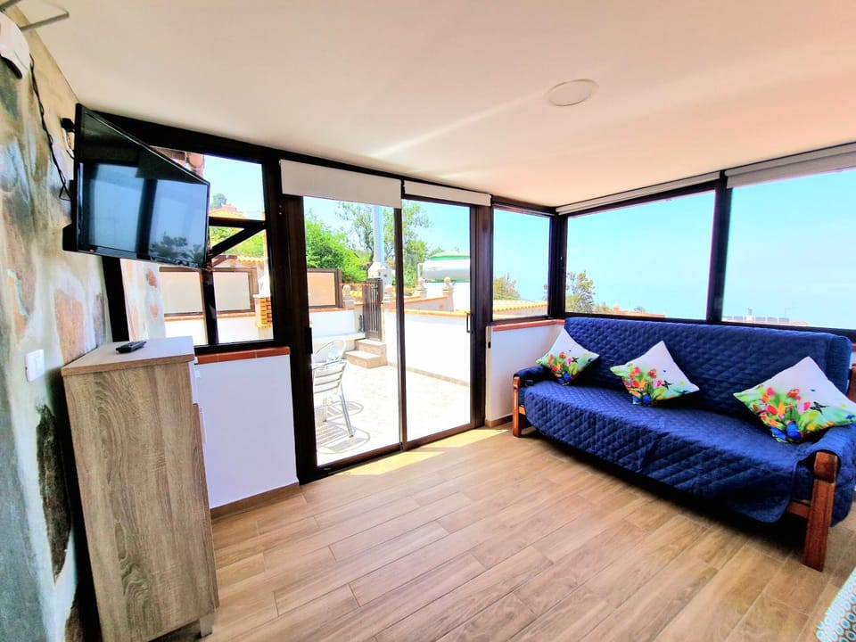 Natural landscape, TV and multimedia, View (from property/room), Living room, Seating area, Sea view